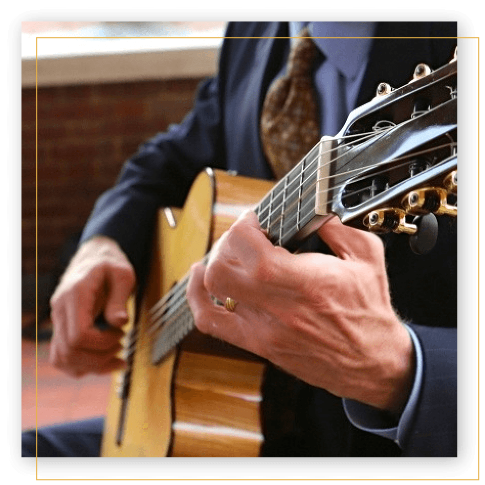 Close-up of Michael Kolmstetter playing guitar